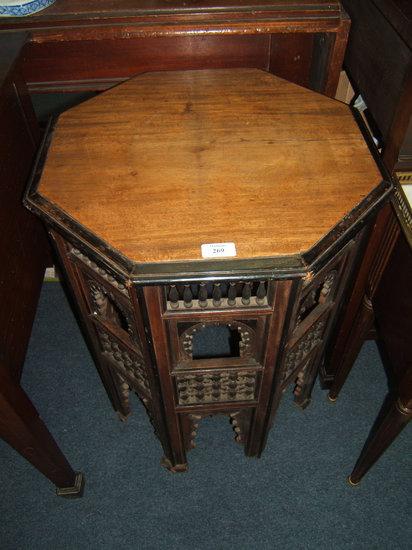 Appraisal: A Moorish style ebonised mahogany octagonal occasional table the pierced