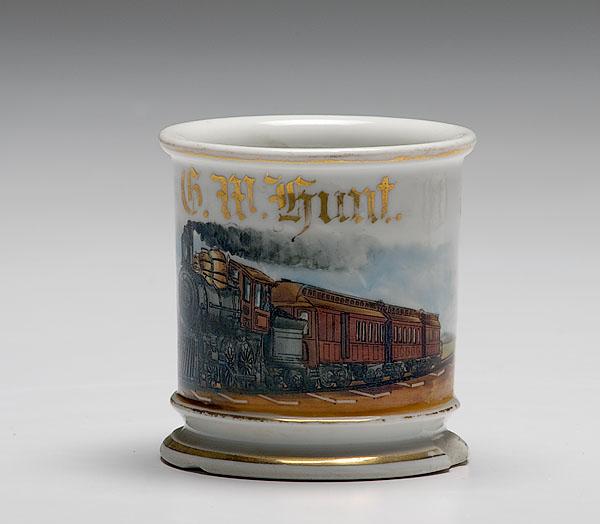 Appraisal: OCCUPATIONAL SHAVING MUG OF RAILROAD ENGINEER porcelain with polychrome painted