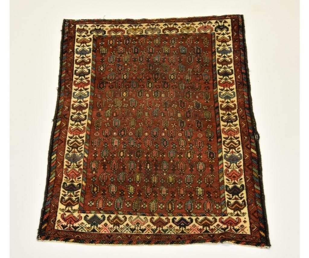 Appraisal: Persian mat with red field geometric patterns '- x '-