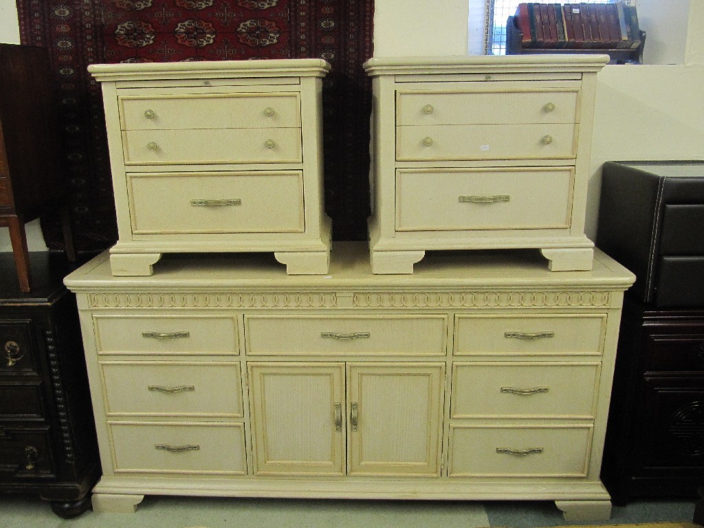 Appraisal: Modern limed oak effect sideboard and a pair of matching