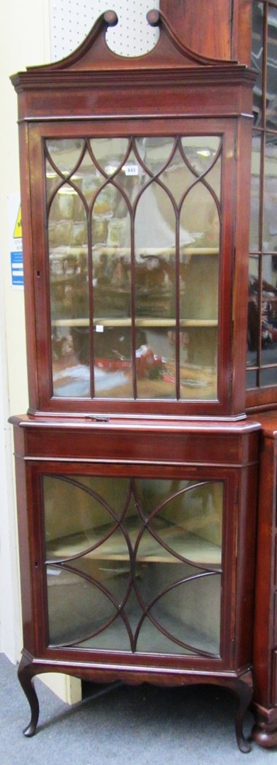 Appraisal: An Edwardian rosewood banded mahogany corner double height display cabinet