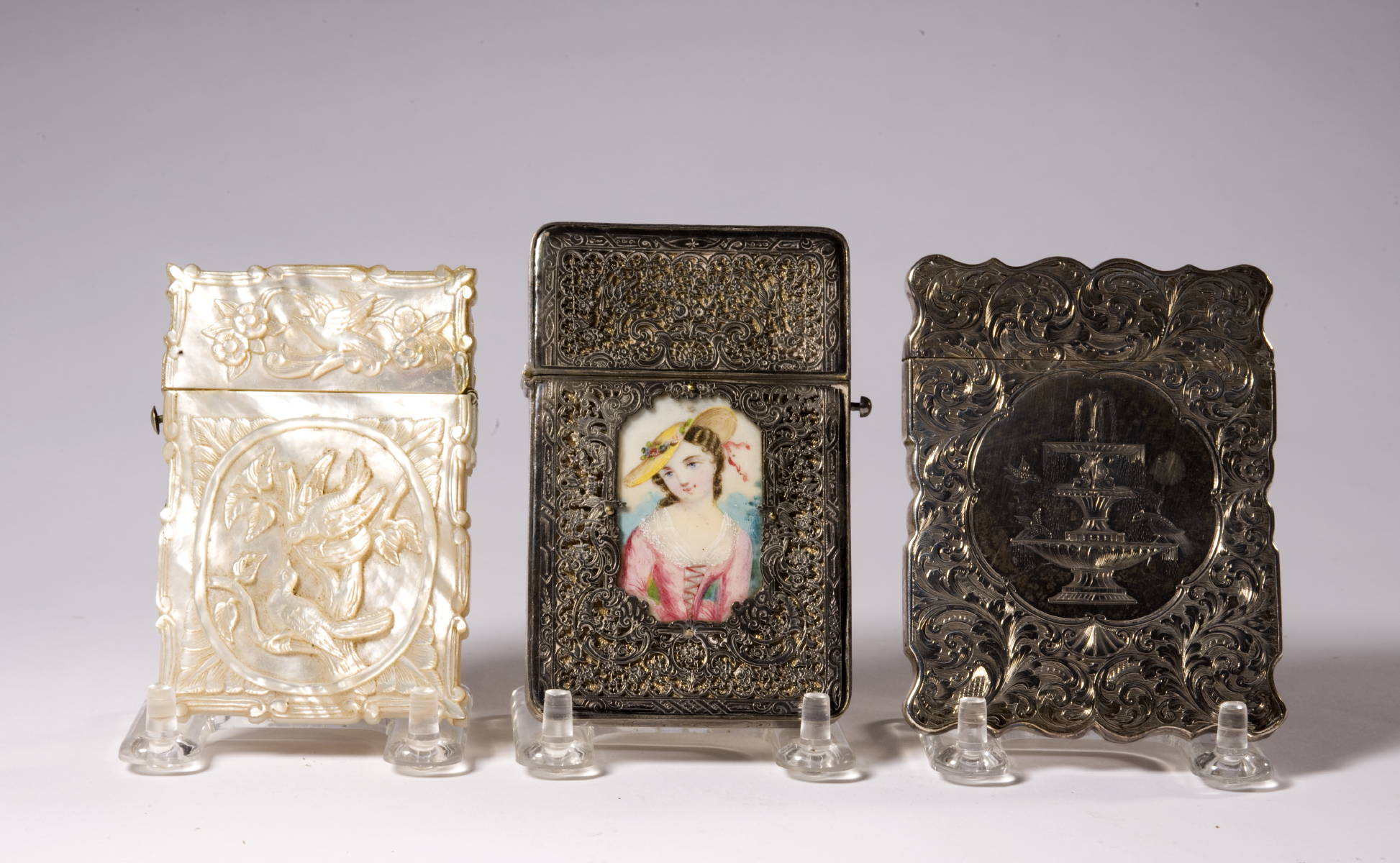 Appraisal: THREE VICTORIAN CARD CASES INCLUDING A CARVED MOTHER OF PEARL