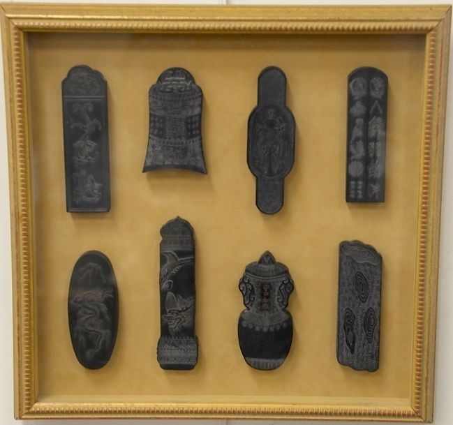 Appraisal: Set of eight black stone seals having carved dragons phoenix