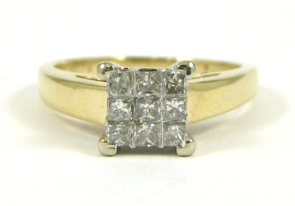 Appraisal: DIAMOND AND FOURTEEN KARAT GOLD RING with nine princess-cut diamonds