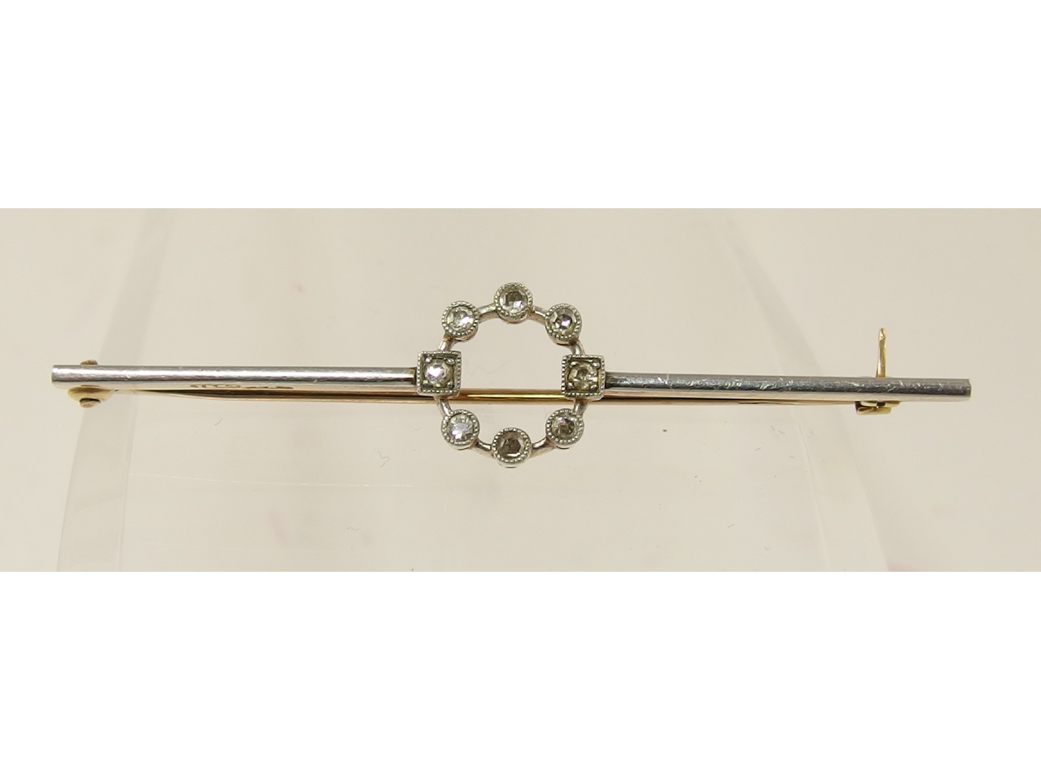 Appraisal: A ct and platinum bar brooch with a circlet of