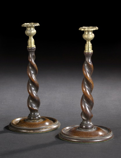 Appraisal: Pair of Edwardian Rope-Twist-Carved and Brass-Mounted Oak Candlesticks first quarter