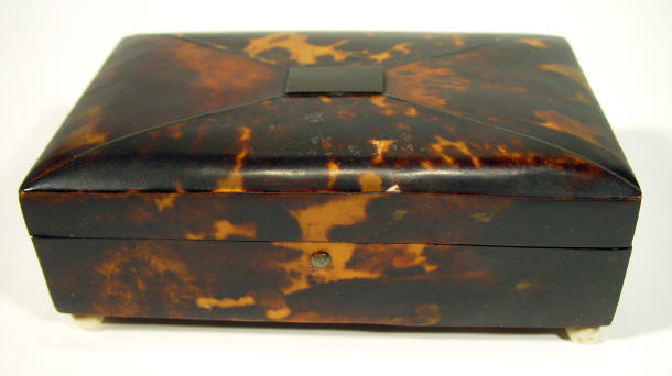 Appraisal: Rectangular th Century tortoiseshell box with hinged lid on ivory