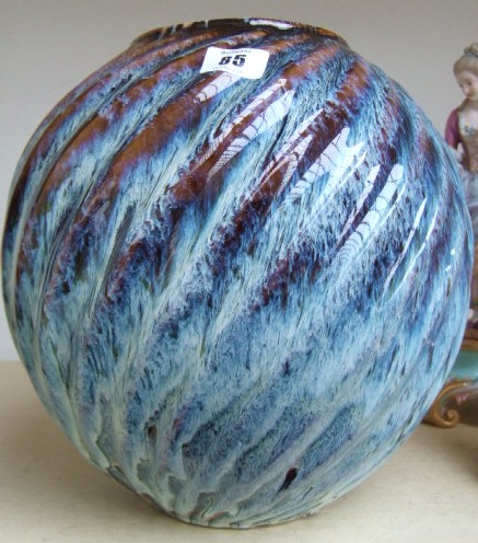 Appraisal: A studio vase with mottled blue glaze against a spiral