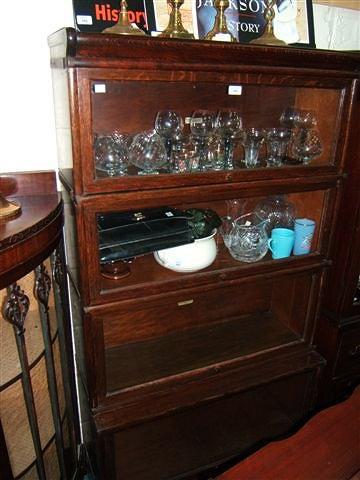 Appraisal: A dark oak glazed Globe Wernicke bookcase four sections wide