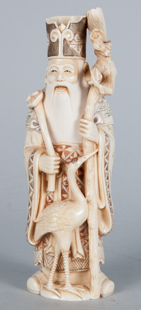 Appraisal: Japanese carved ivory deity polychrome ink highlights signed in characters