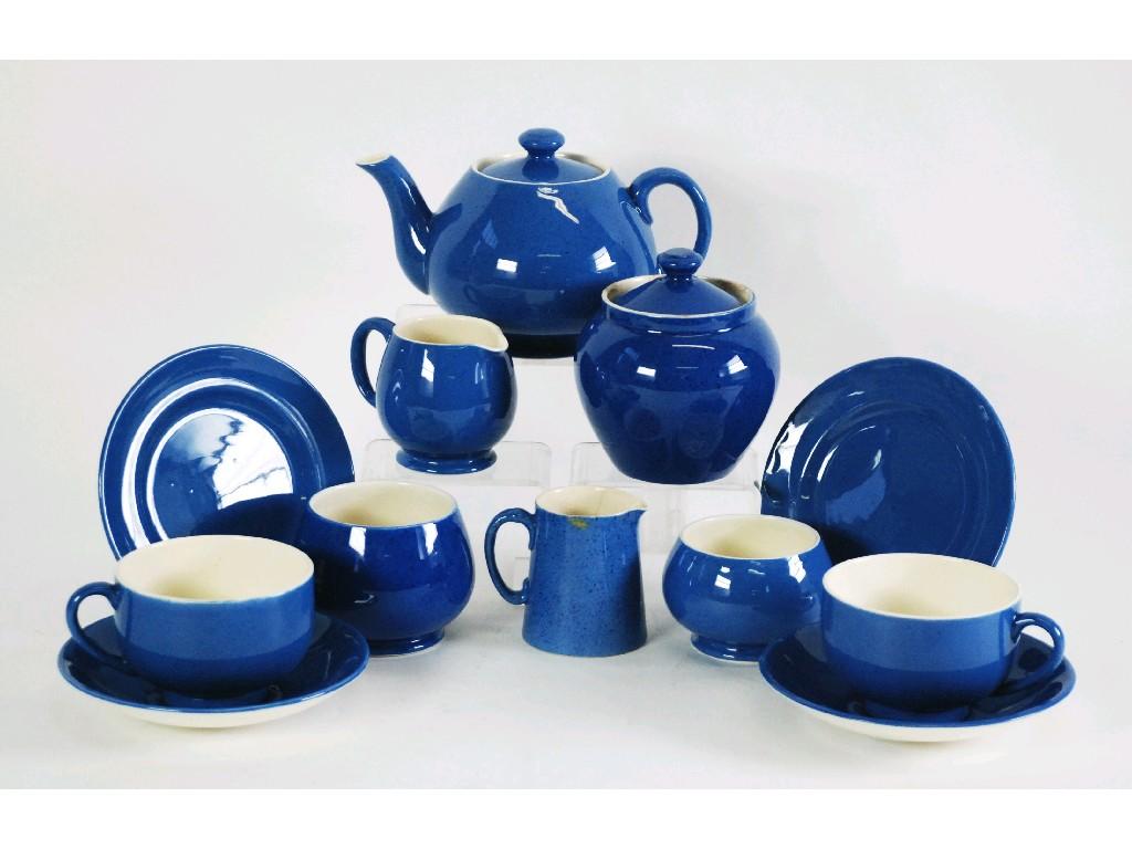 Appraisal: WALTER MOORCROFT NINE PIECE POWDER BLUE GLAZED POTTERY TEA FOR