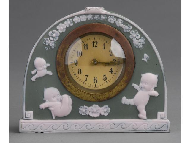 Appraisal: Rose O'Neill Kewpie Clock Germany ca green jasperware-type clock case