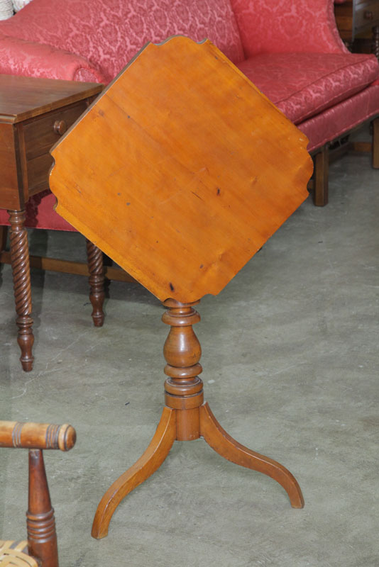 Appraisal: COUNTRY TILT-TOP CANDLESTAND American th century Refinished cherry Tripod base