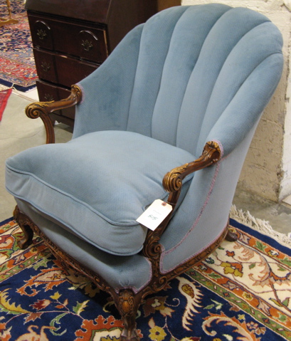 Appraisal: BLUE CHANNEL-BACK ARMCHAIR American mid th century with acanthus-carved wood