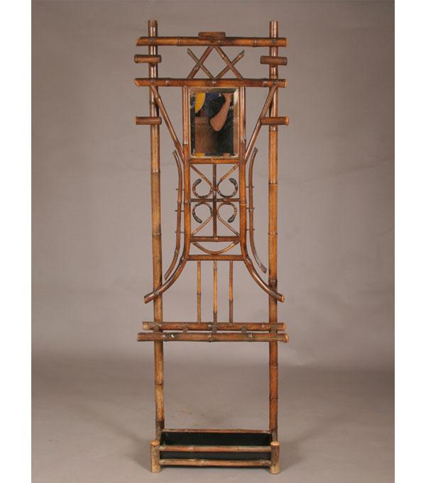 Appraisal: Victorian hall tree bamboo construction beveled mirror cane umbrella holder