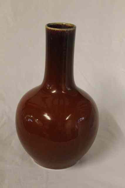 Appraisal: A CHINESE SANG DE BOEUF BOTTLE VASE th Century