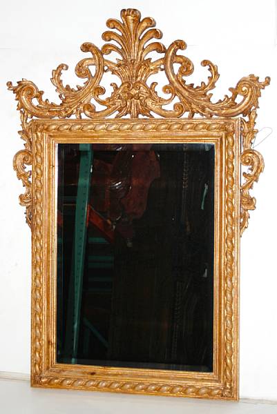 Appraisal: A Rococo style carved and giltwood mirror early th century