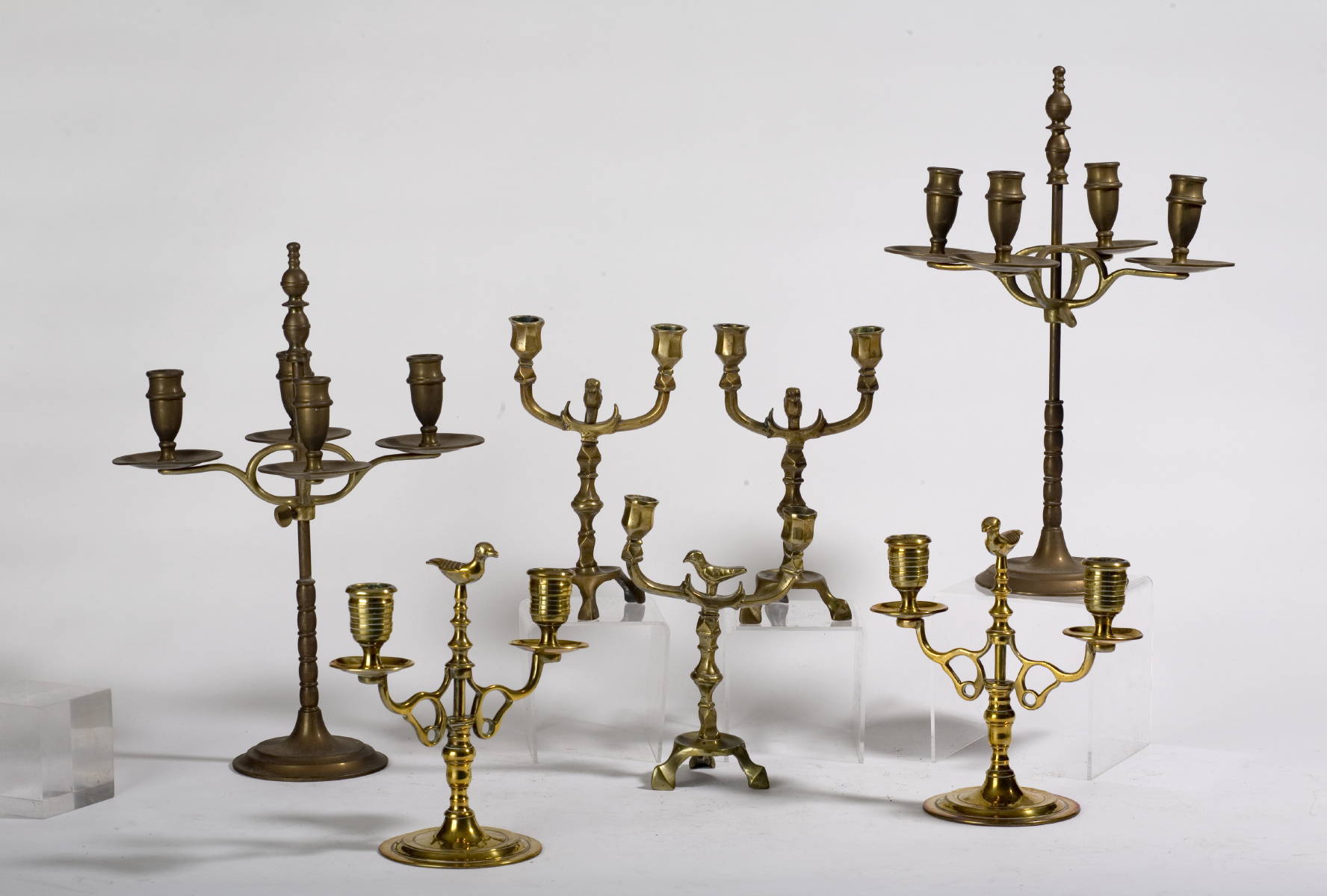 Appraisal: COLLECTION OF ENGLISH BRASS CANDELABRA INCLUDING TWO PAIR AND A