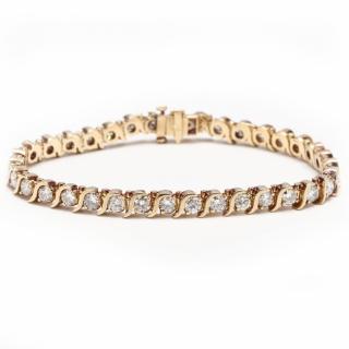 Appraisal: KT Diamond Bracelet the flexible line bracelet with prong set