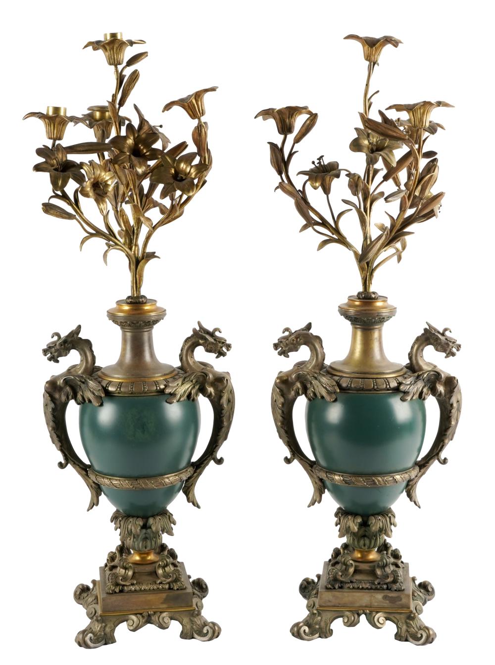 Appraisal: PAIR OF GILT BRONZE-MOUNTED PORCELAIN URNSunmarked each flanked by dragon's