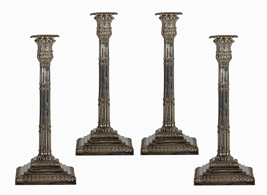 Appraisal: A set of four plated candlesticks of compound column form