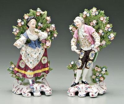 Appraisal: Pair Chelsea figures figures in Colonial attire extensive floral embellishment