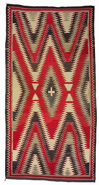 Appraisal: A large Navajo rug A lone cross centered within a