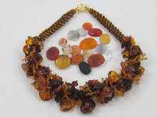 Appraisal: A naturalistic amber necklace together with a collection of unmounted