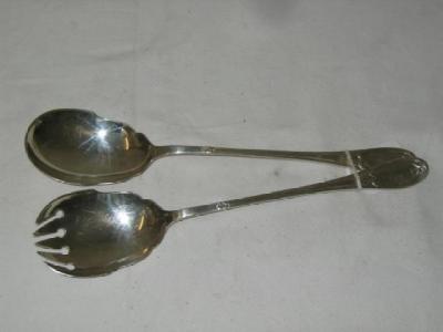 Appraisal: A PAIR OF SALAD SERVERS with shaped bowls the handles