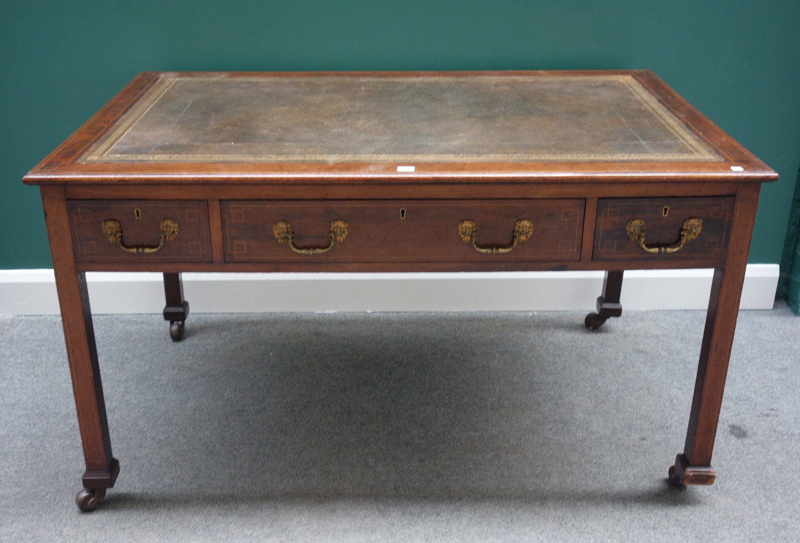 Appraisal: An th century style mahogany centre writing table with three