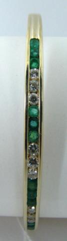 Appraisal: k yellow gold emerald and diamond bangle bracelet containing diamonds