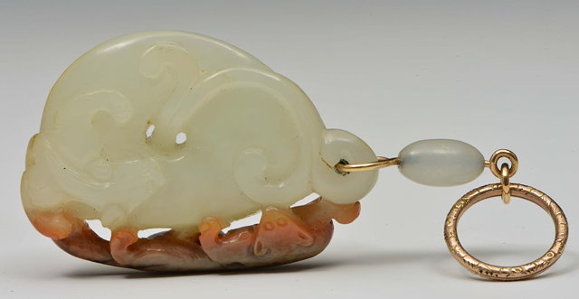 Appraisal: A CHINESE WHITE JADE AND RUST JADE PENDANT carved as