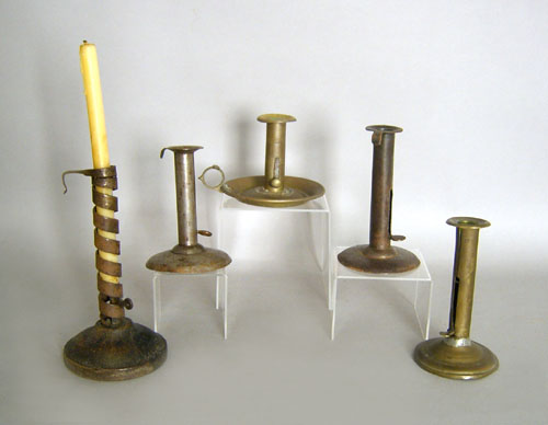 Appraisal: Three hogscraper candlesticks together with a twist ejector and a