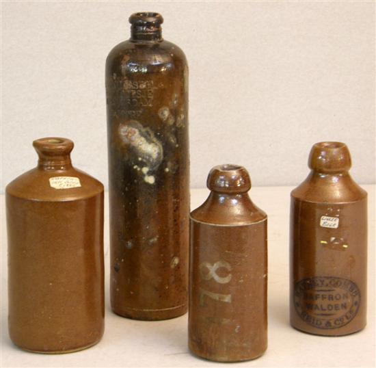 Appraisal: Four stoneware bottles to include a tall cylindrical bottle with