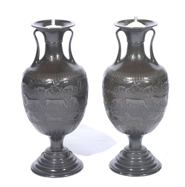 Appraisal: A PAIR OF BRONZE TWO HANDLED URNS each having a