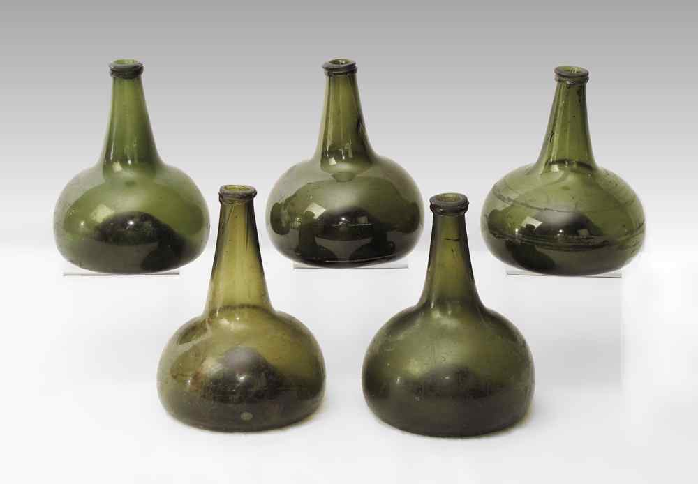 Appraisal: FIVE TH CENTURY GREEN DUTCH ONION BOTTLES Largest measures ''