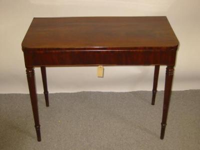 Appraisal: A MAHOGANY FOLDING TEA TABLE early th century of rounded