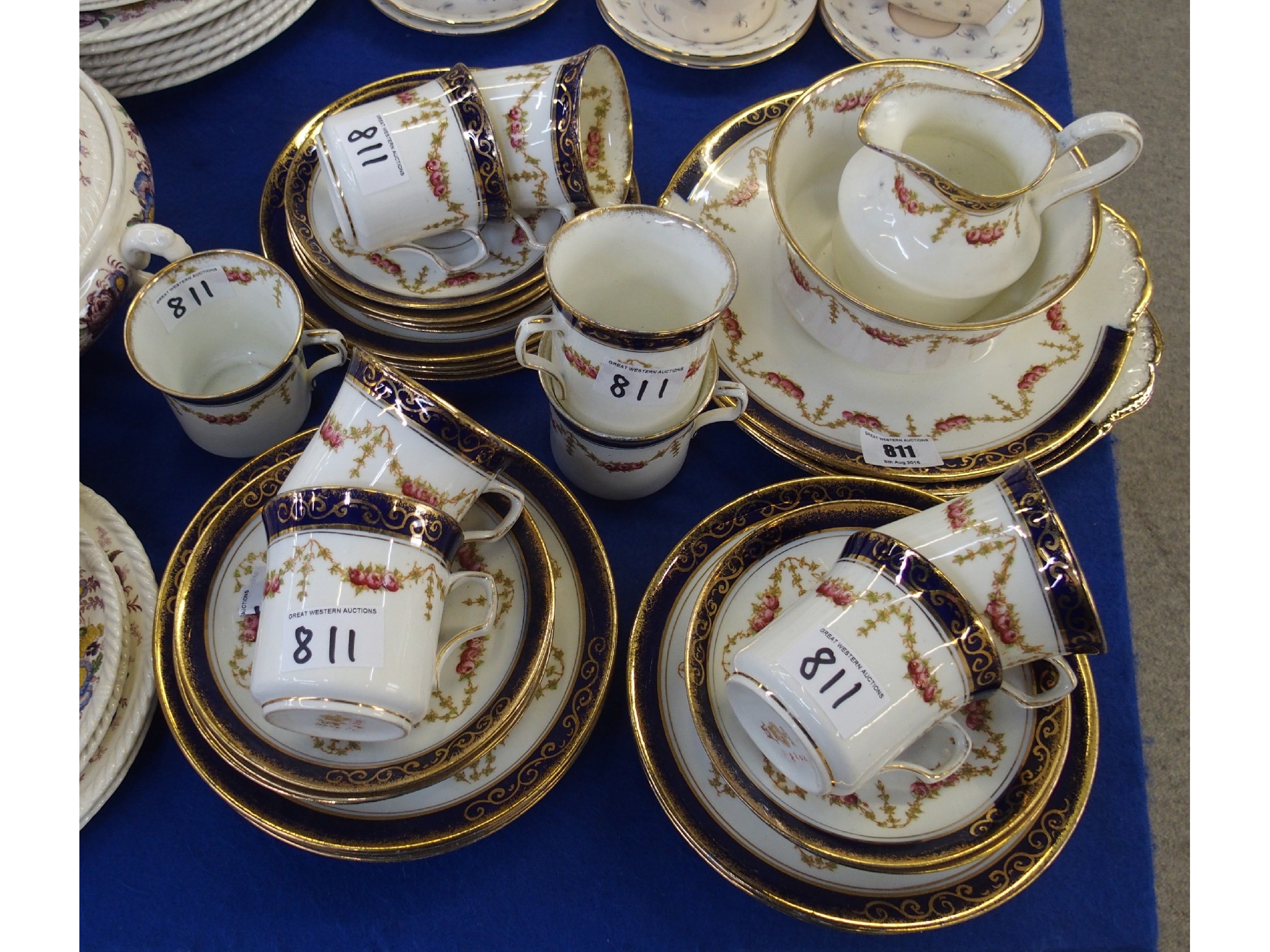 Appraisal: English porcelain parcel gilt teaset for eight marked Nave