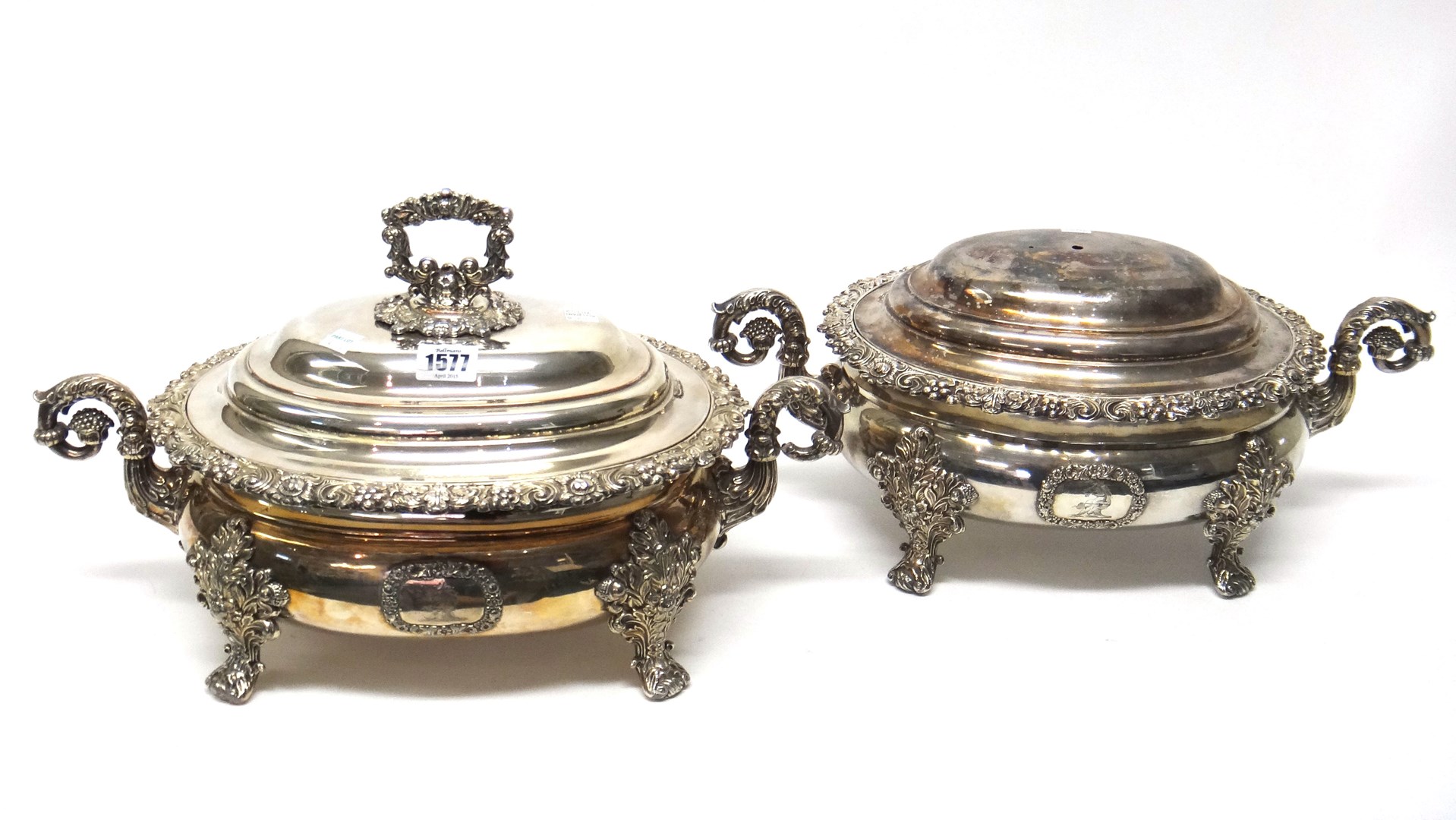 Appraisal: A pair of Old Sheffield plated twin handled lidded tureens