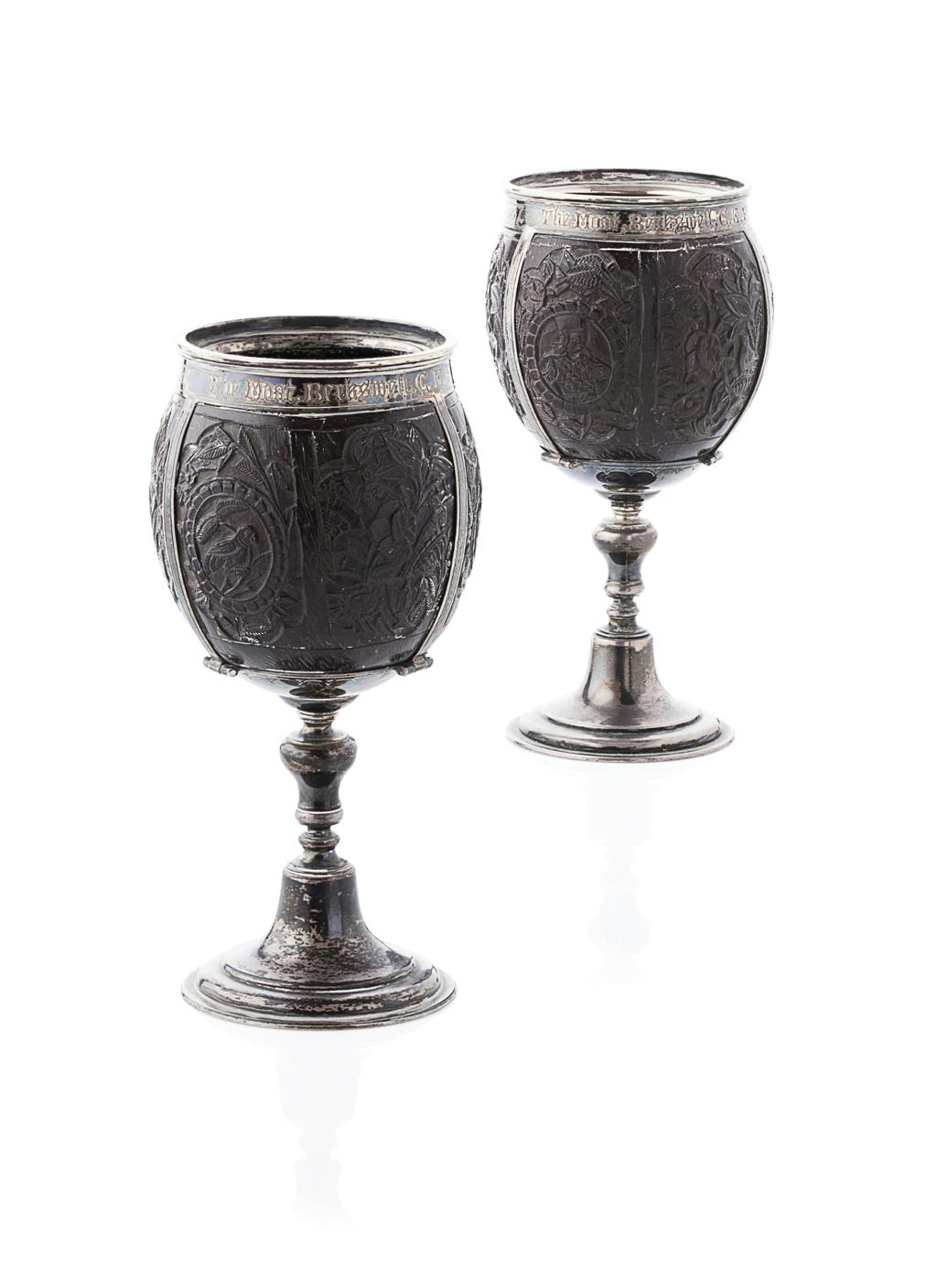 Appraisal: A pair of late th century silver mounted coconut cups