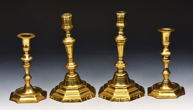 Appraisal: A PAIR OF TH CENTURY BRASS CANDLESTICKS of octagonal form