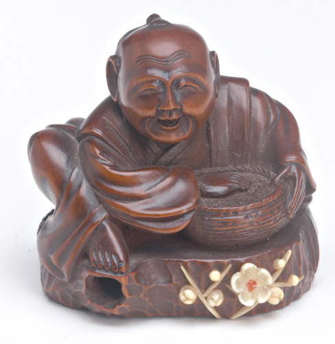 Appraisal: JAPANESE NETSUKE Carved wood figure of a man sitting on