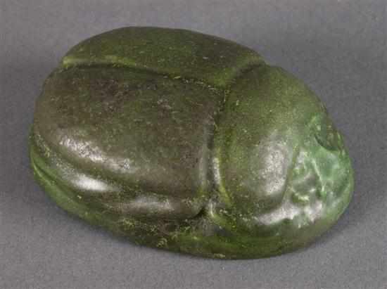 Appraisal: Grueby green glazed terracotta scarab paperweight circa modeled as traditional