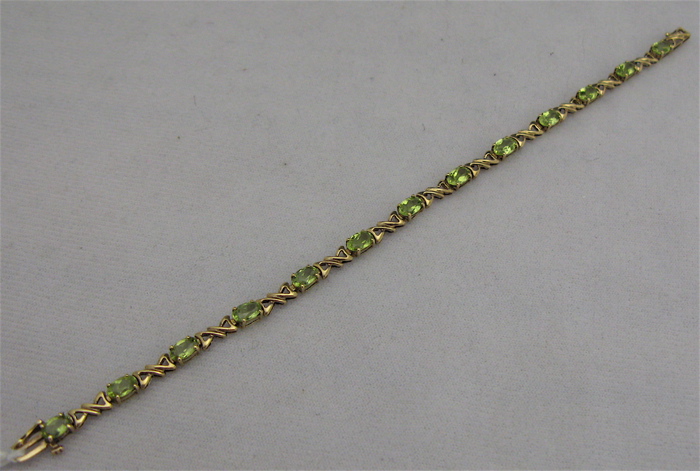 Appraisal: PERIDOT AND TEN KARAT GOLD BRACELET - inches in length