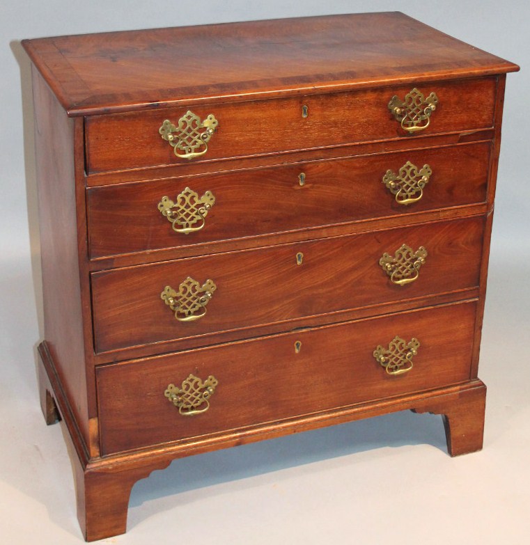 Appraisal: A principally thC mahogany chest of four long graduated cockbeaded