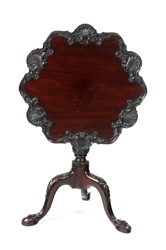 Appraisal: CARVED CHIPPENDALE-STYLE TILT-TOP TEA TABLE Labeled for Potthast Brothers Baltimore