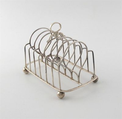 Appraisal: A George IV six division toast rack on ball feet