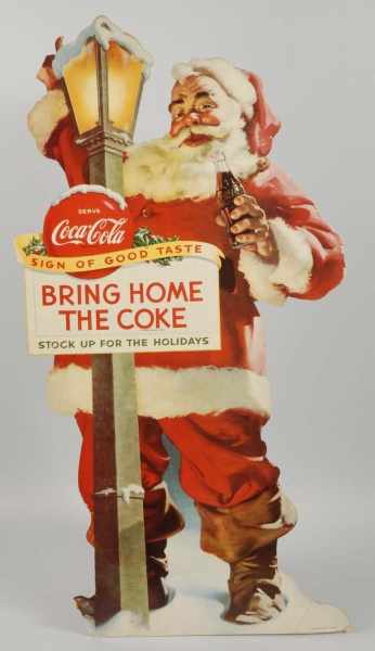 Appraisal: Cardboard Canadian Coca-Cola Santa Cutout Description Lower left portion and