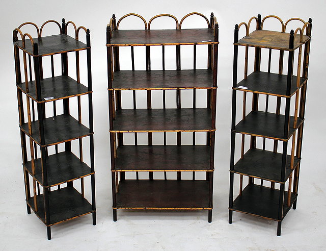 Appraisal: A PAIR OF RATTAN WHATNOTS with lacquered shelves cm wide