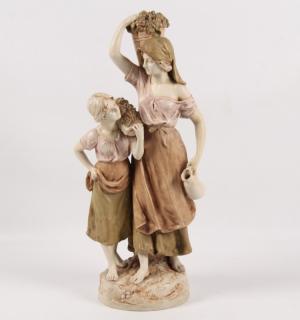 Appraisal: ROYAL DUX FIGURE OF PEASANT GIRLS CARRYING GRAPES THE LARGER